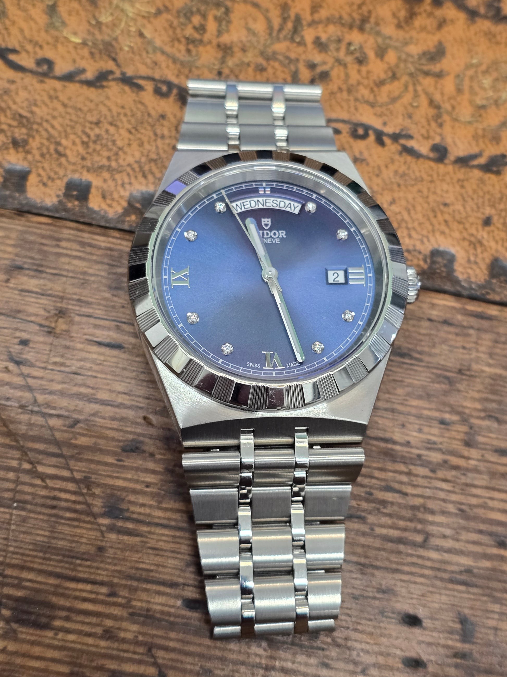 Reeves and Sons Tutor Royal Day Date Diamond Watch model 28600 showing gold case, diamond accents, and day/date display.