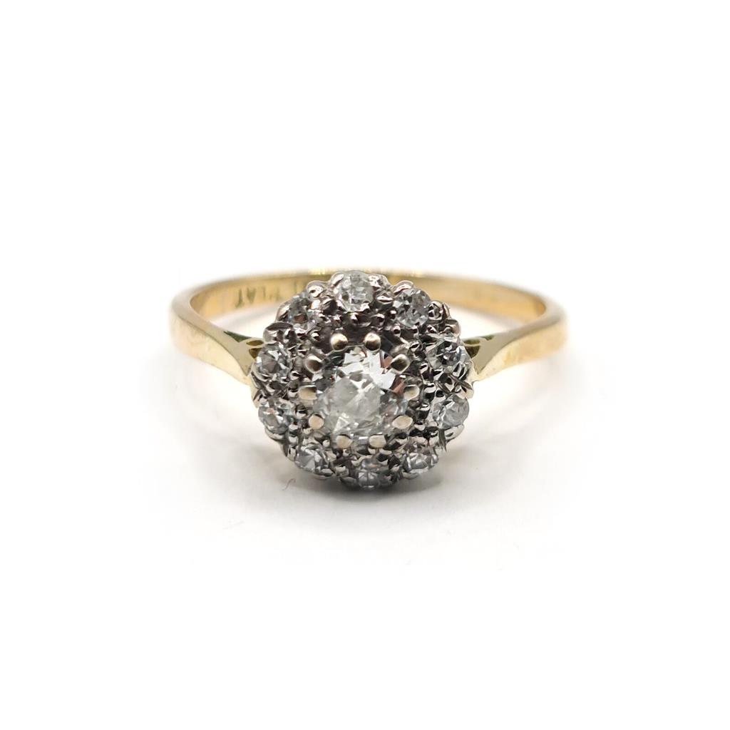 https://shared1.ad-lister.co.uk/UserImages/f9858451-6400-46df-9300-45516e64c4e1/Img/Diamondrings/18ct-055-carat-diamond-cluster-ring-p0.jpg