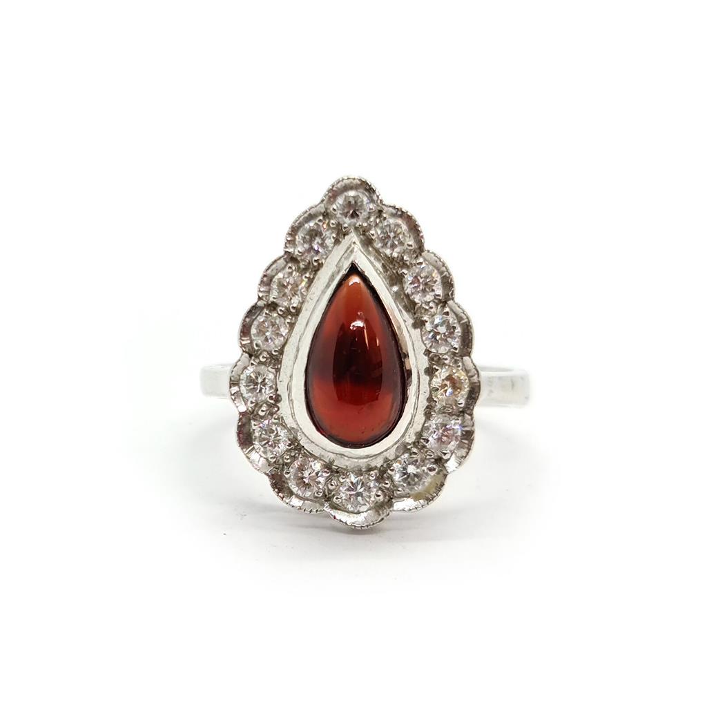 https://shared1.ad-lister.co.uk/UserImages/f9858451-6400-46df-9300-45516e64c4e1/Img/Diamondrings/18ct-white-gold-160-crt-Garnet--060-crt-diamond-ring-p0.jpg
