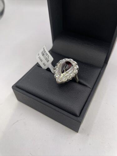 https://shared1.ad-lister.co.uk/UserImages/f9858451-6400-46df-9300-45516e64c4e1/Img/Diamondrings/18ct-white-gold-160-crt-Garnet--060-crt-diamond-ring-p4.jpg