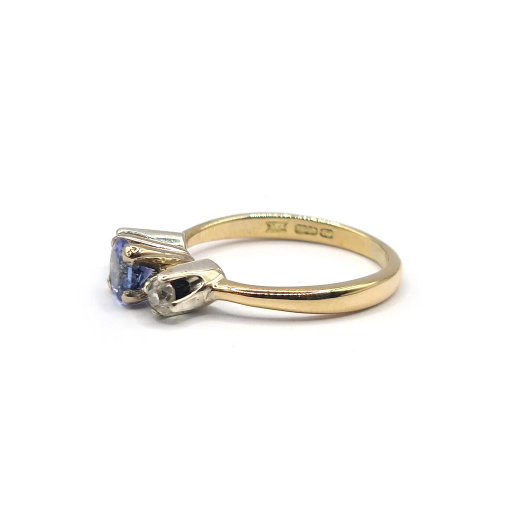 https://shared1.ad-lister.co.uk/UserImages/f9858451-6400-46df-9300-45516e64c4e1/Img/Diamondrings/18ct-yellow-gold-040-carat-tanzanite--020-carat-diamond-ring-p1.jpg