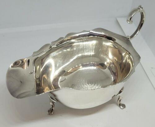 https://shared1.ad-lister.co.uk/UserImages/f9858451-6400-46df-9300-45516e64c4e1/Img/Silver/solid-silver-jug-p0.jpg